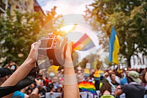 Correspondent takes photo during the Gay Pride parade