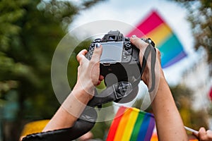 Correspondent takes photo during the Gay Pride parade