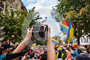 Correspondent takes photo during the Gay Pride parade