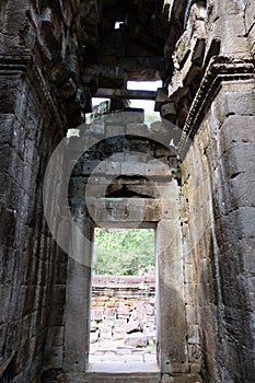 Corridor and doorway of an old stone building. The ruins of a medieval monastery in Indochina