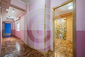 a corridor of an empty house with former owners lacking in taste for decoration