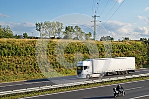 Corridor highway with truck and motorcycle