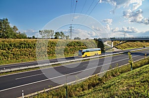 Corridor highway with yellow bus