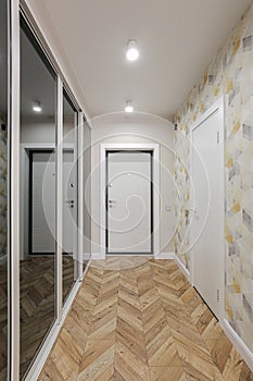 Corridor in the interior of the apartment with sliding wardrobe