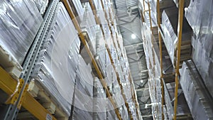 corridor of large logistics commerce warehouse structure with boxes on the shelf. industry