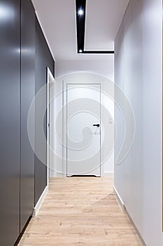 Corridor in modern design apartment with closet and seat