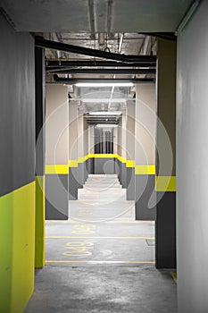 Corridor in a new spacious underground parking lot formed with symmetric pillars, Sao Paolo, Brazil