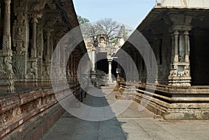 A corridor between the Pillared cloisters and the Ranga Mandapa, Virupaksha Temple, Hampi, karnataka. Sacred Center. View from the