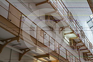 Corridor in the prison with balcony with cell doors