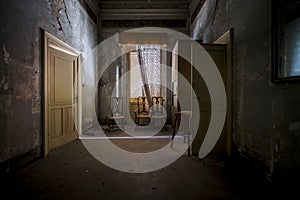 corridor room with chairs in old abandoned large luxurious house