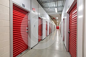 Corridor of self-storage unit with red doors