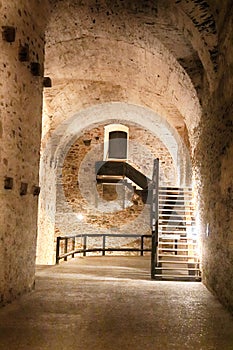 Corridor and stairs in the basement in the Red Stone castle, Pila, Slovakia photo