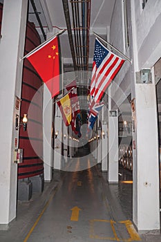 Corridor with tanks for wine storage and flags