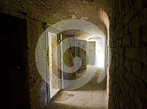 Corridor to isolation cells in an abandoned prison photo