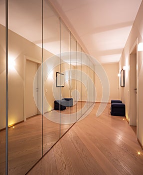 Corridor with wardrobes and mirrors