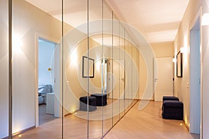 Corridor with wardrobes and mirrors