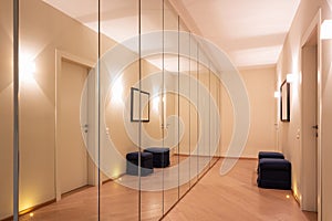 Corridor with wardrobes and mirrors photo