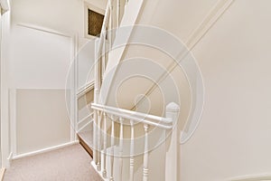 Corridor with a white staircase