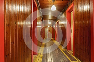 Corridor with wooden paneling inside a mountain cottage