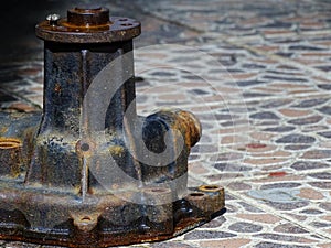Corroded waterpump of engine in the backyard photo