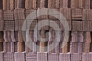 Corrugate cardboard tied with white plastic rope. Corrugated paper single wall. Corrugated fiberboard. Linerboard board. photo