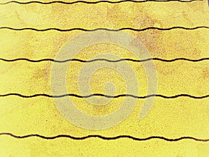 Corrugated canvas in modern golden yellow with violet wavy lines ideal for background, pattern, textile, website,paper,tapeta,abst photo