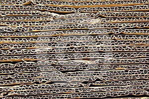 Corrugated cardboard background. Stack of old paper sheets