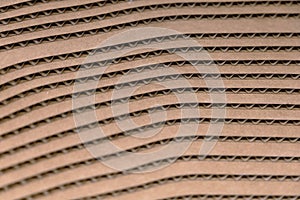corrugated cardboard used for packing and shipping and made out of recycled goods