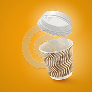 Corrugated fiberboard coffe cup to go on yellow background photo