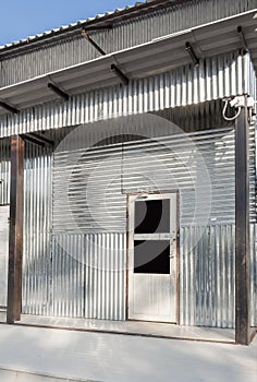 Corrugated galvanized steel surface silver of temporary shelter for construction workers and Industrial factory building. Iron