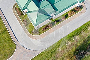 Corrugated green metallic house roof aerial view