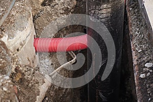 Corrugated for insulation cable of wires underground, plastic tubes, big black pipe with insulation for water, red
