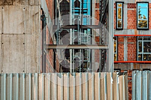 Corrugated metal fence on construction site