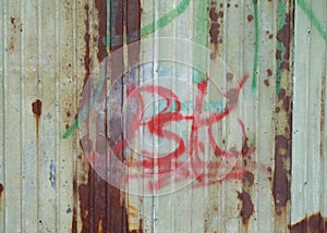 Corrugated metal wall with text paint