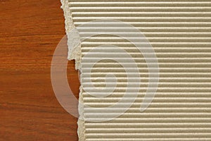 Corrugated paperboard on wood table background