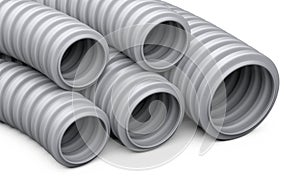 Corrugated pipe for installation of electrical cable. Grey plastic curvilinear hoses set.