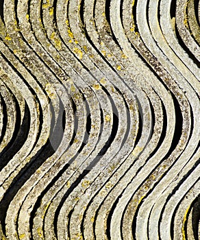 Corrugated slate in a pile, side view background texture of slate