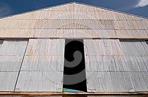 Corrugated zinc hangar with open doors