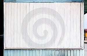 Corrugated zinc surface white and blue of the house is a roadside shop for the background and texture. With copy space for text.