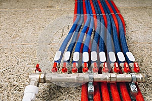 Corrugation pipes with ball valves in boiler room photo