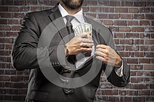 Corrupt man holding bills of money