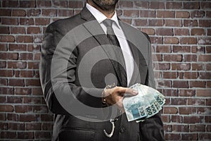 Corrupt man holding bills of money