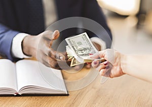 Corrupted businessman making black deal, taking bribe money from partner