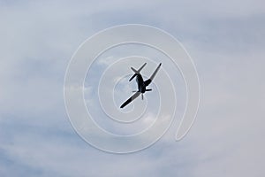 Corsair Airplane Flying through the air with Grey Clouds in the Background