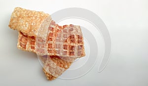 `corteza de  cerdo` pork rinds on isolated white background with copy space photo