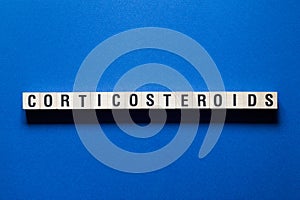 Corticosteroids word concept on cubes photo