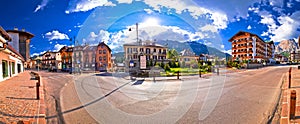 Cortina D` Ampezzo street and Alps peaks panoramic view photo