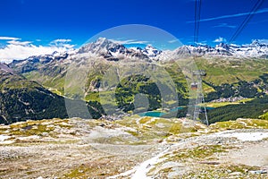 Corvatsch cable car with Upper Engadin Valley in Swiss Alps