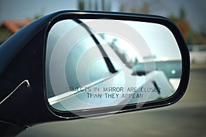 Corvette side mirror with the words, Objects in mirror are closer than they appear