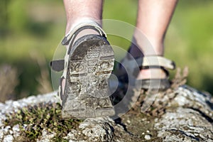 Coseup of sport shoes on trail walking in mountains, outdoors ac photo